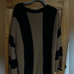 Oversized knit striped sweater with bell sleeves